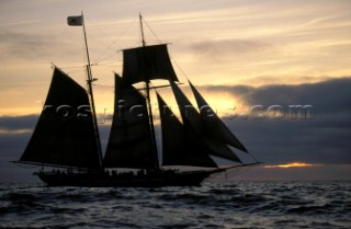 Classic schooner at sunset