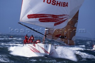 Whitbread 60 Toshiba surfing downwind under spinnaker.