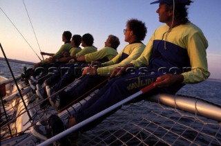 Crew on the windward rack of an Ultra 30 racing boat