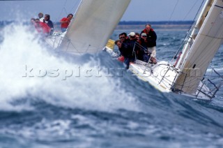 Two sailing boats racing in rough seas