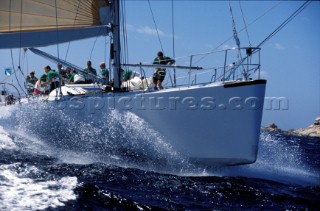 Maxi yacht sailing downwind under spinnaker