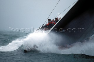 Bow of maxi racing yacht ÔStealthÕ crashes through a wave in poor conditions