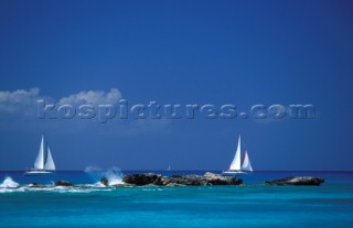 Yachts cruising in a Caribbean sea off the coast of St Martin