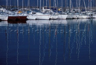 Reflection of masts in marina