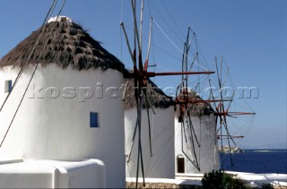 Three white windmills, found on the Greek island of Mykonos