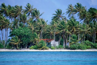 Hut on remote sandy beach, French Polynesia