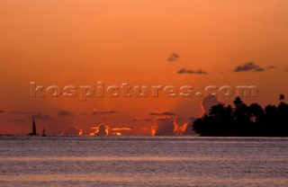 Red sky at sunset, clouds on horizon, Polynesia