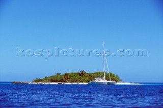 Catamaran anchored off remote Polynesian island