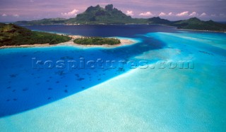 Aerial view of the shallow waters off the coast of Bora Bora, French Polynesia