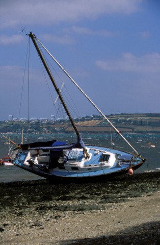 Westerly cruising yacht washed ashore following a storm which broke its anchor chain Mylor Cornwall