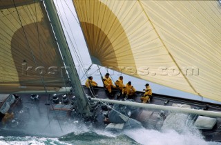 Crew on windward rail of classic yacht Valsheda in rough seas