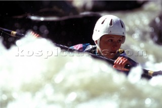 A canoeist competes in rough water
