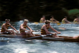 Two rowing fours race at Royal Henley Regatta on the river Thames, UK
