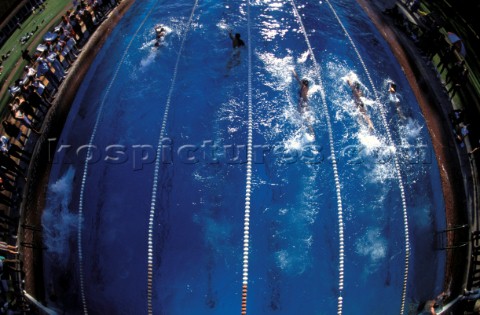 Wide angle aerial view of a race in a swimming pool