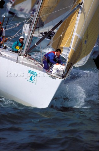 Bowman prepares sail on foredeck