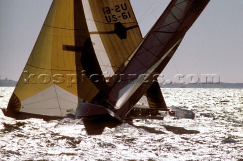 Two Americaa Cup yachts cross tacking in a match race