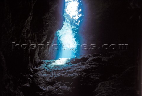 Small cave with sunshafts underwater diving in Los Gigantes in Tenerife