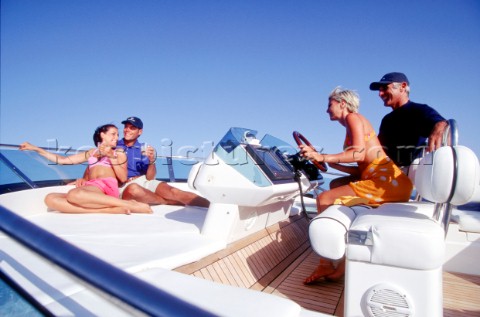 Guests relaxing on the flybridge of a Squadron 62