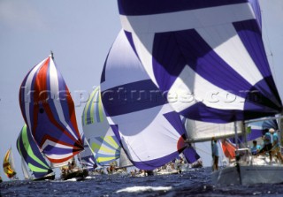 Colourful spinnakers of fleet racing at Antigua Sailing Week