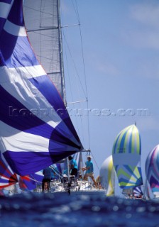 Colourful spinnakers of fleet racing at Antigua Sailing Week