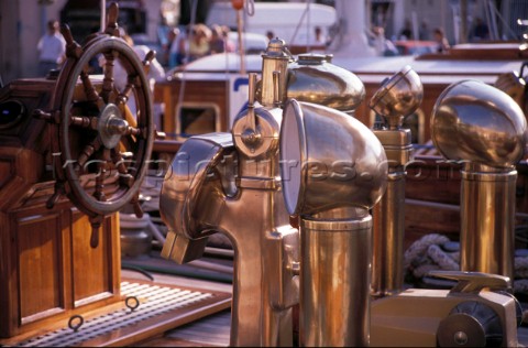 Brass dorades and wheel on a classic yacht