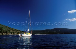 Cruising yacht moored in a secluded bay, Greece