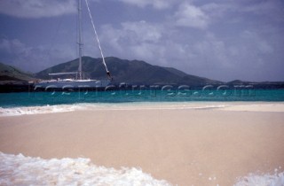 Swan 55 at anchorage by a sandy spit in the Caribbean