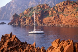 40ft cruising yacht at anchor in a secluded bay in Corsica in the Mediterranean