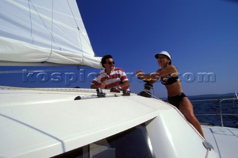 Couple onboard a crusing catamaran