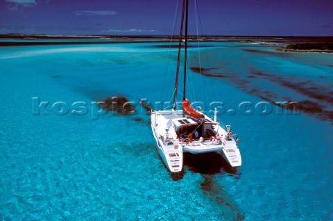 Catamaran anchored in clear blue water  Alans Key Bahamas