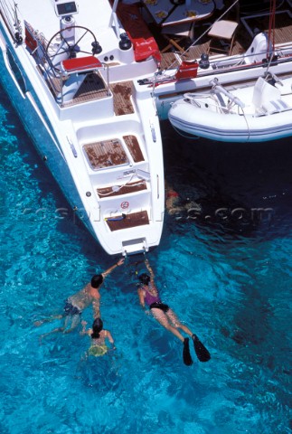 Swimming off the stern  Alans Key anchorage Bahamas