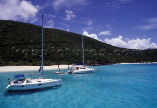 White Bay BVI   Two boats at anchor in clear, shallow water
