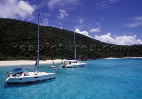 White Bay BVI   Two boats at anchor in clear shallow water
