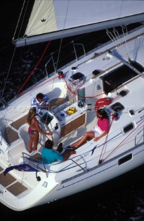Under full sail - Two couples enjoying a yacht charter