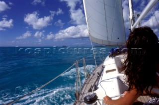 Girl onboard a cruising charter yacht in the Caribbean