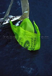 Teamwork onboard IACC yacht America One as they drop the green spinnaker