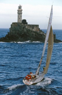 Whitbread 60 racing yacht Toshiba rounds Fastnet rock.  Fastnet Race 1997