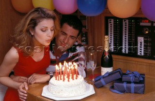 Birthday Celebrations on Board Lifestyle - Charter 99 Romantic couple celebrate a birthday onboard a yacht during a cruising holiday