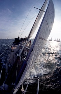 View from bow of racing yacht looking back at crew