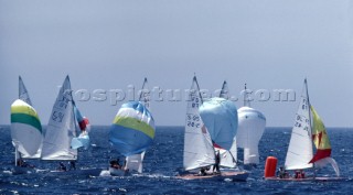 Fleet of Flying Dutchman dinghies racing down wind