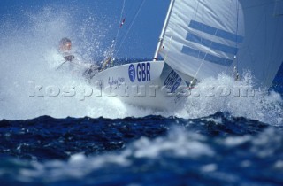 Ian Walker and Mark Covell in a Star keelboat crashing through a wave at the Sydney Olympics 2000