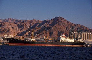Tanker moored infront on mountains