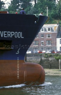 Ship leaving port in restricted river