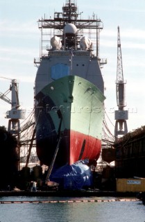 Commercial ship undergoes maintenance in a dry dock