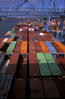 Unloading containers from a ship at Royal Seaforth dock, Liverpool, UK