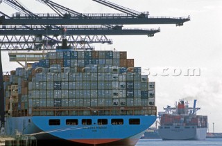Container ship in a port being loaded
