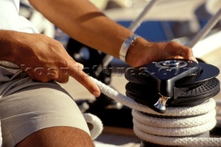 Detail of hands on winch