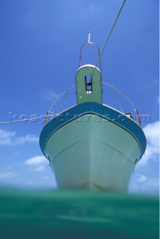 Profile of moored motor boat from surface of the water 