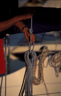 Tidying lines on a sailing yacht