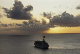 Aerial View of cruise ship under way at sunset